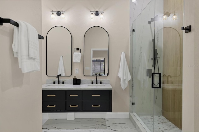 bathroom featuring vanity and an enclosed shower