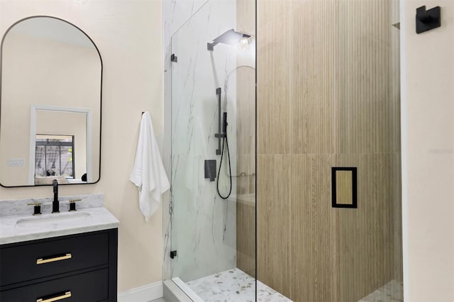 bathroom featuring vanity and a shower with shower door