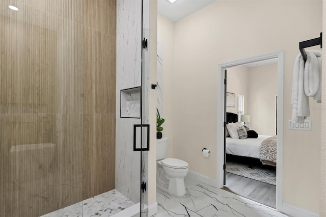 bathroom featuring toilet and an enclosed shower