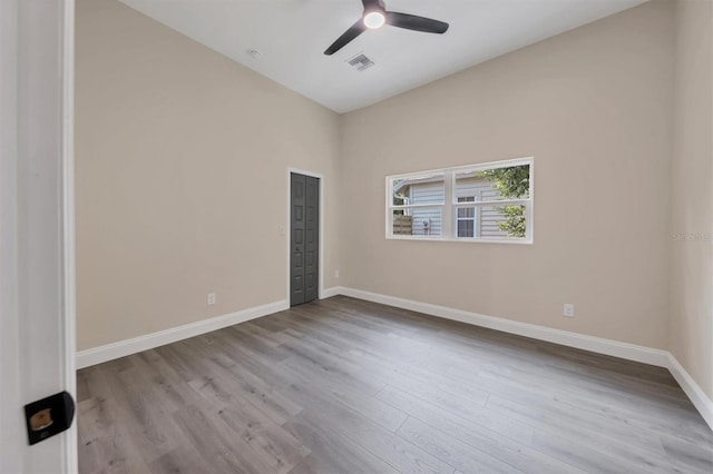 spare room featuring light hardwood / wood-style flooring and ceiling fan