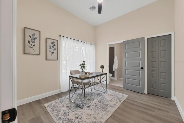 office area with ceiling fan and wood-type flooring