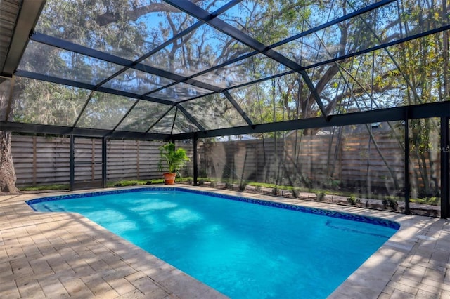 view of pool featuring a lanai and a patio