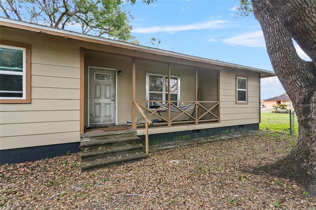 entrance to property with covered porch