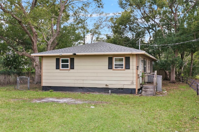 view of property exterior with a lawn