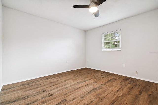 spare room with ceiling fan and hardwood / wood-style flooring