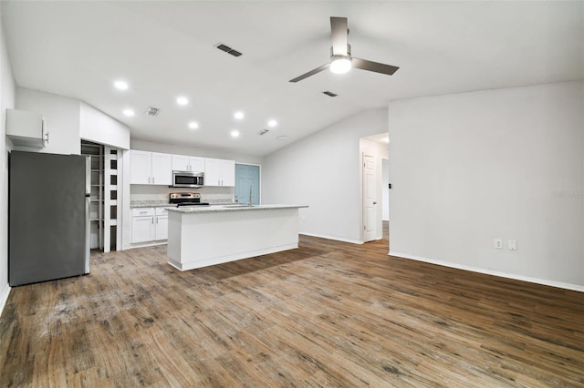 kitchen featuring white cabinetry, ceiling fan, wood-type flooring, a center island with sink, and appliances with stainless steel finishes