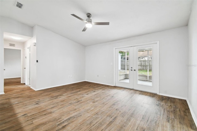 spare room with ceiling fan, french doors, and hardwood / wood-style floors