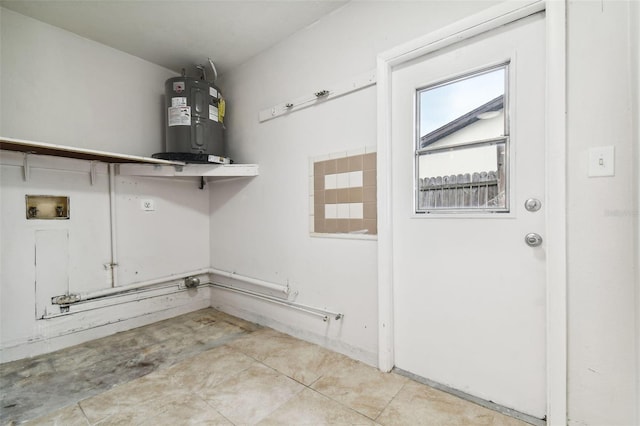 laundry area with hookup for a washing machine and electric water heater