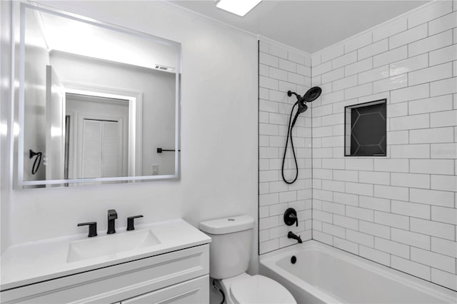 full bathroom with vanity, tiled shower / bath combo, crown molding, and toilet