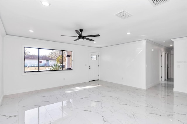 empty room featuring ornamental molding and ceiling fan