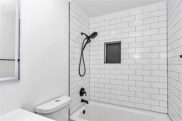 bathroom featuring toilet and tiled shower / bath combo