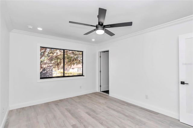 unfurnished room featuring crown molding, ceiling fan, and light wood-type flooring