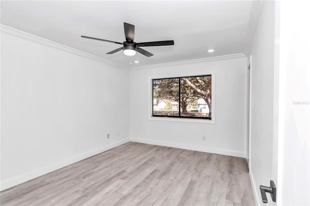 spare room with crown molding, ceiling fan, and light hardwood / wood-style flooring