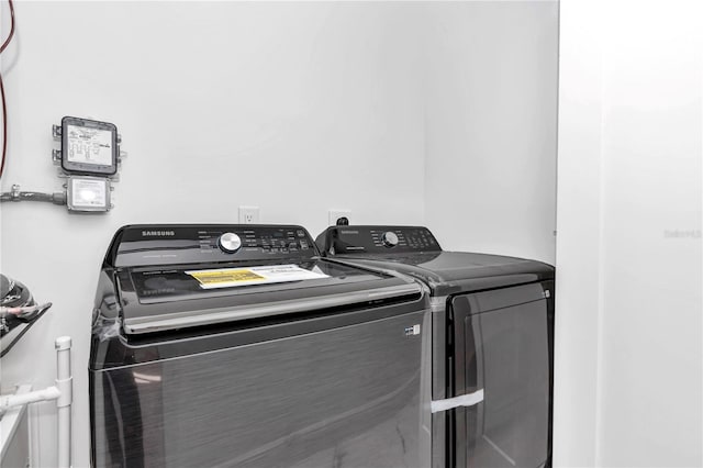 laundry area with independent washer and dryer