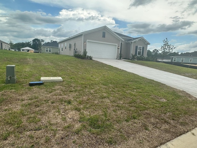 view of front of home with a garage and a front yard