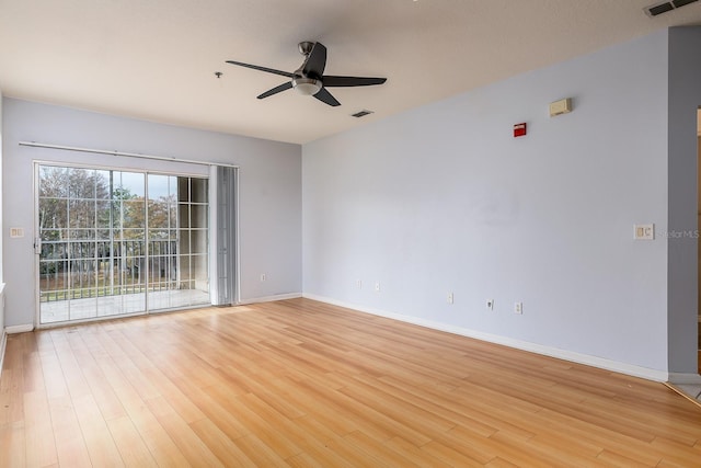 empty room featuring ceiling fan and light hardwood / wood-style floors