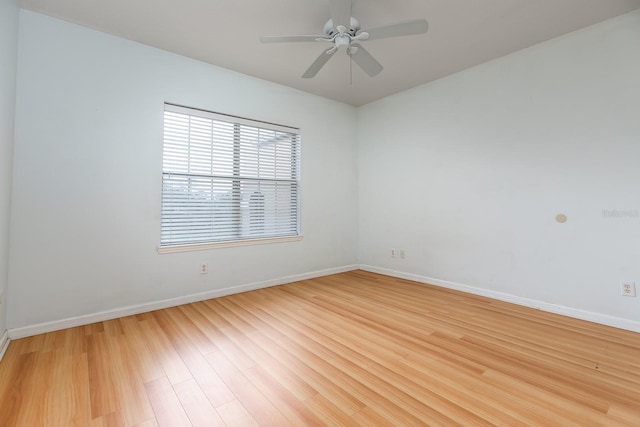 empty room with ceiling fan and wood-type flooring