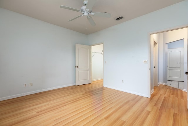 unfurnished bedroom featuring ceiling fan and light hardwood / wood-style flooring