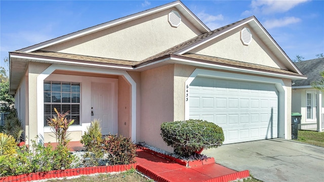 view of front of home with a garage