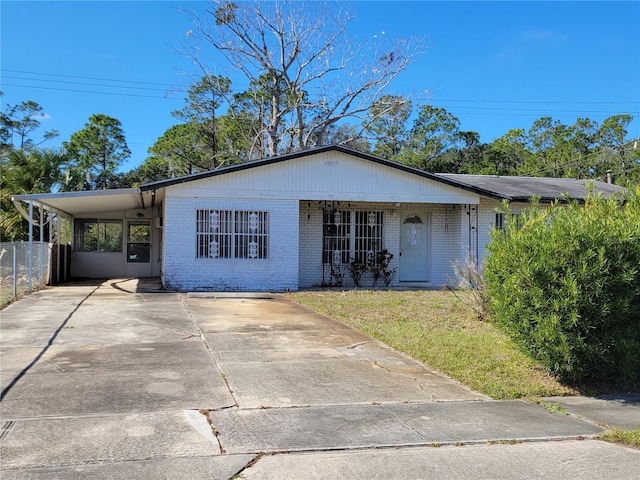 view of front of home with a carport