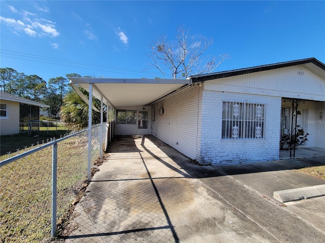 view of home's exterior with a carport