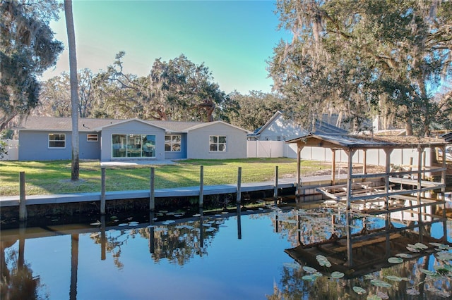 exterior space with a lawn and a water view