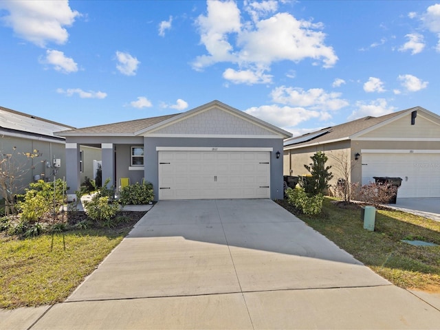 ranch-style house with a front lawn and a garage