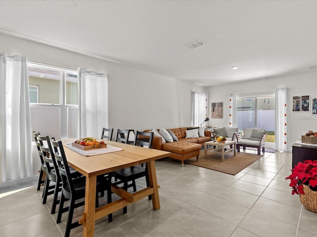 dining space with light tile patterned flooring