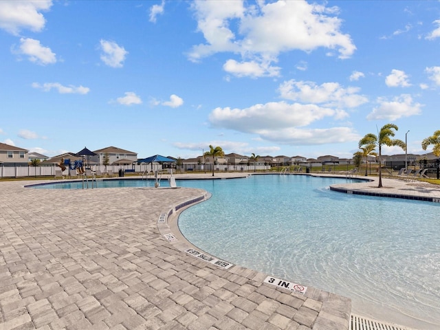 view of swimming pool with a patio area