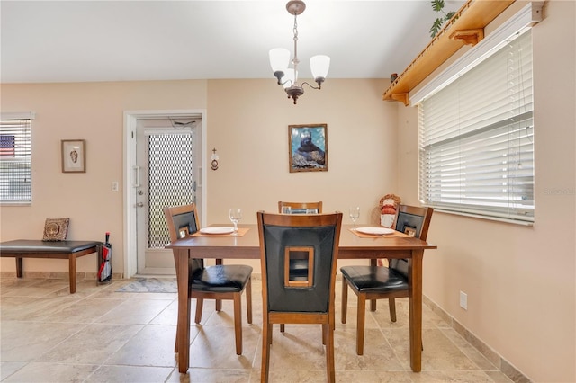 dining room featuring a chandelier