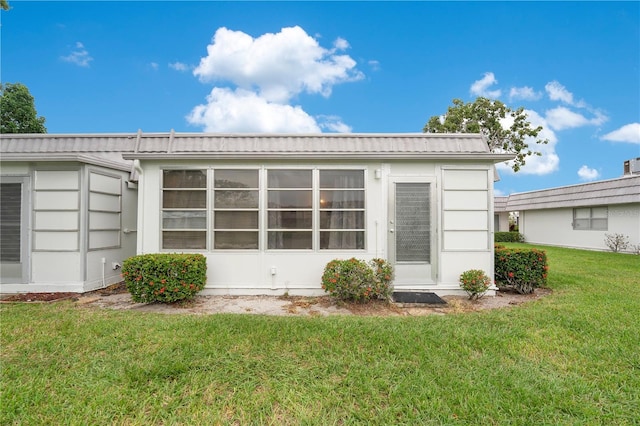 exterior space with a lawn