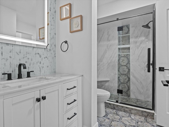 bathroom with vanity, toilet, and an enclosed shower