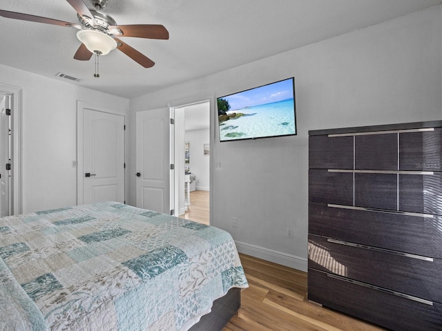 bedroom featuring light hardwood / wood-style flooring and ceiling fan