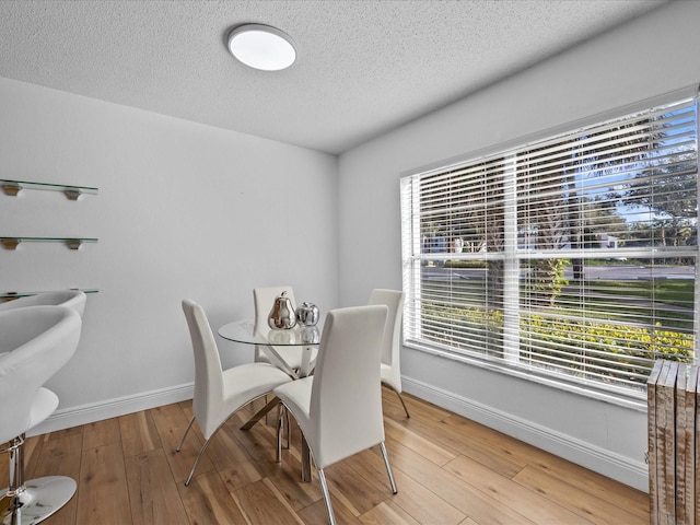 dining space featuring hardwood / wood-style floors