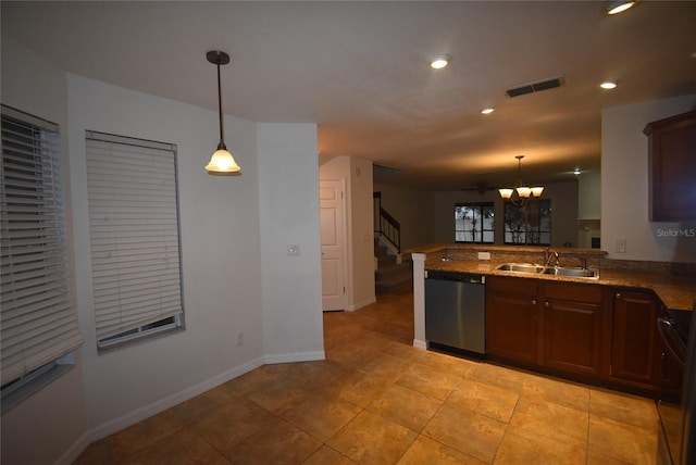 kitchen featuring kitchen peninsula, dishwasher, decorative light fixtures, and sink