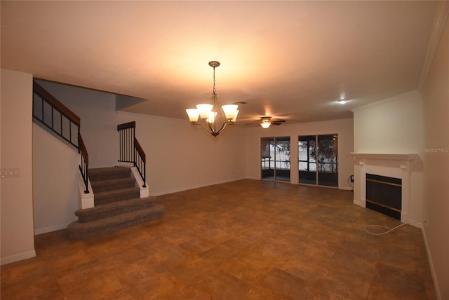 unfurnished living room featuring ceiling fan with notable chandelier and ornamental molding