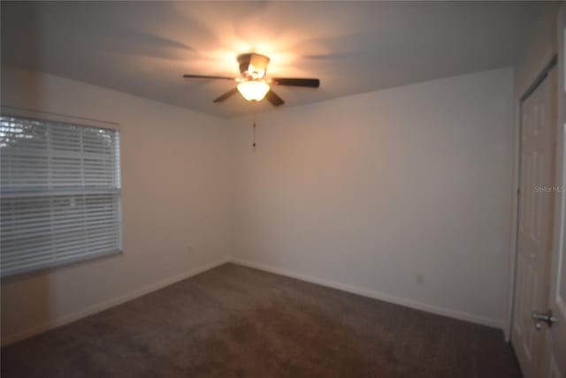 carpeted empty room with ceiling fan