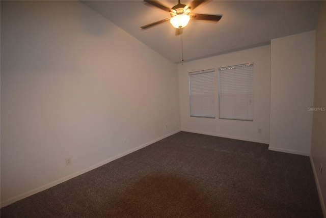 carpeted spare room with ceiling fan and lofted ceiling