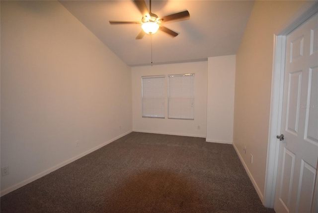 carpeted empty room featuring ceiling fan and lofted ceiling