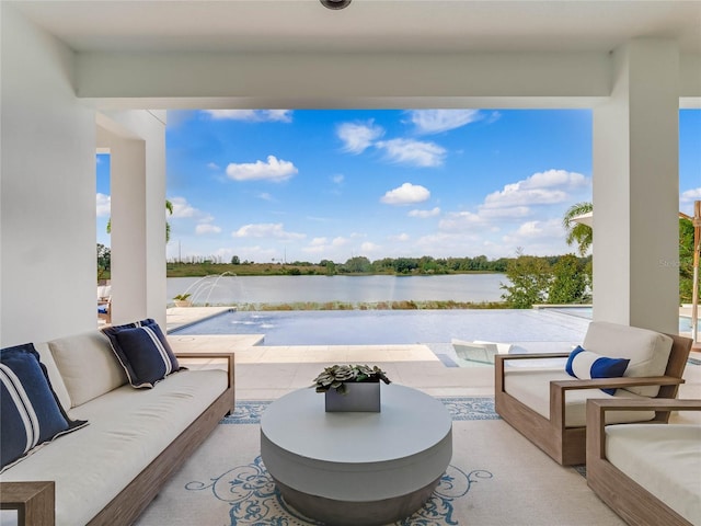 view of patio with outdoor lounge area and a water view