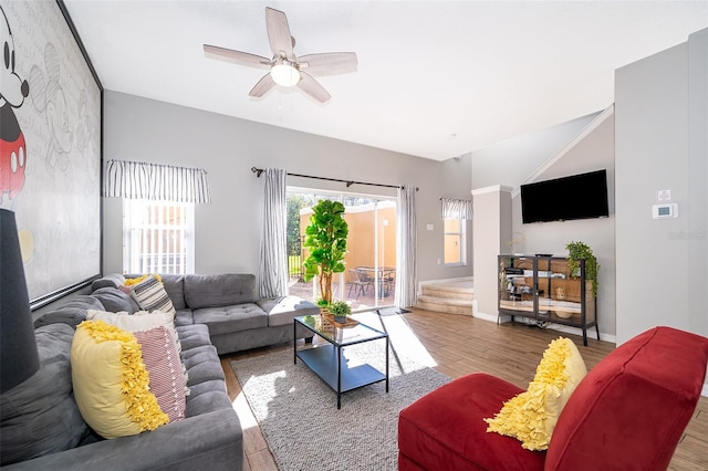 living room featuring hardwood / wood-style floors and ceiling fan