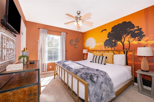 bedroom with light colored carpet and ceiling fan