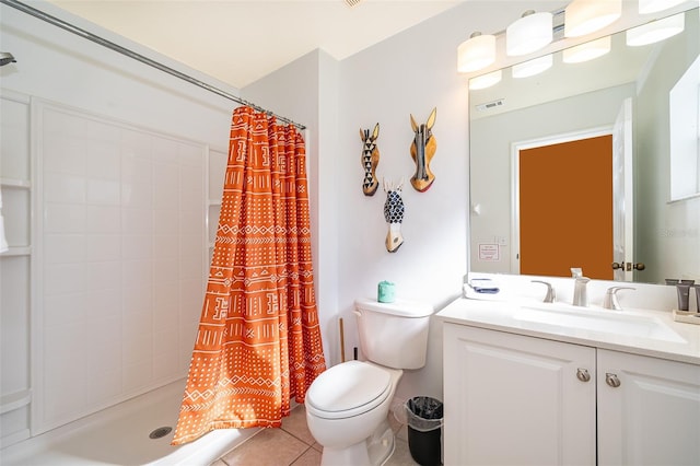 bathroom with tile patterned floors, toilet, vanity, and a shower with shower curtain