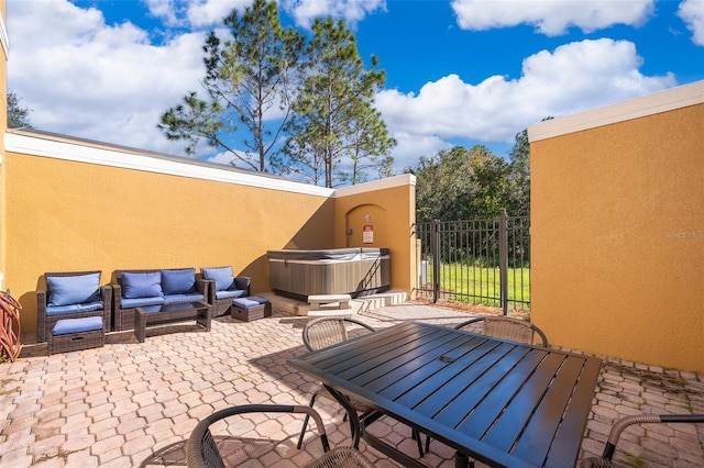 view of patio featuring an outdoor hangout area and a hot tub