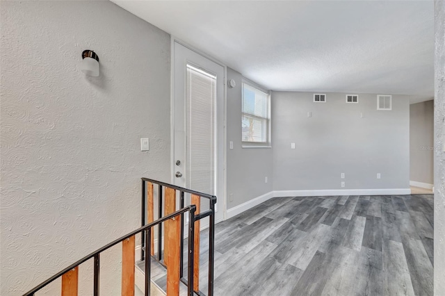 unfurnished room featuring hardwood / wood-style floors