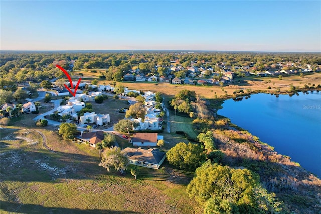 birds eye view of property featuring a water view