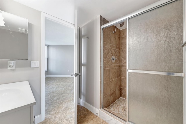 bathroom with tile patterned flooring, vanity, and an enclosed shower