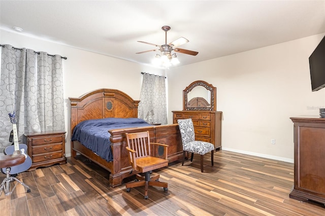 bedroom with ceiling fan and dark wood-type flooring