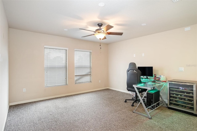 carpeted office space featuring ceiling fan and beverage cooler