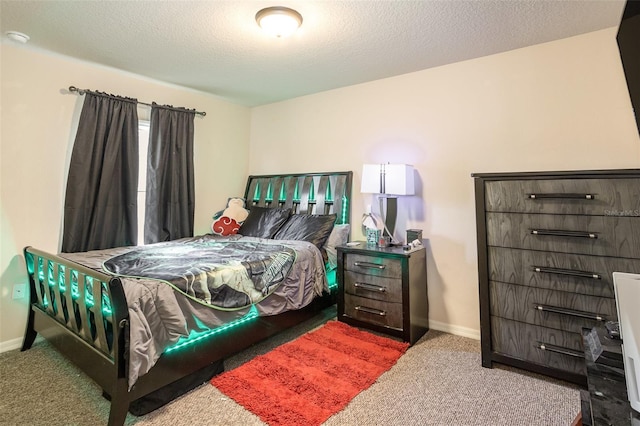 carpeted bedroom with a textured ceiling